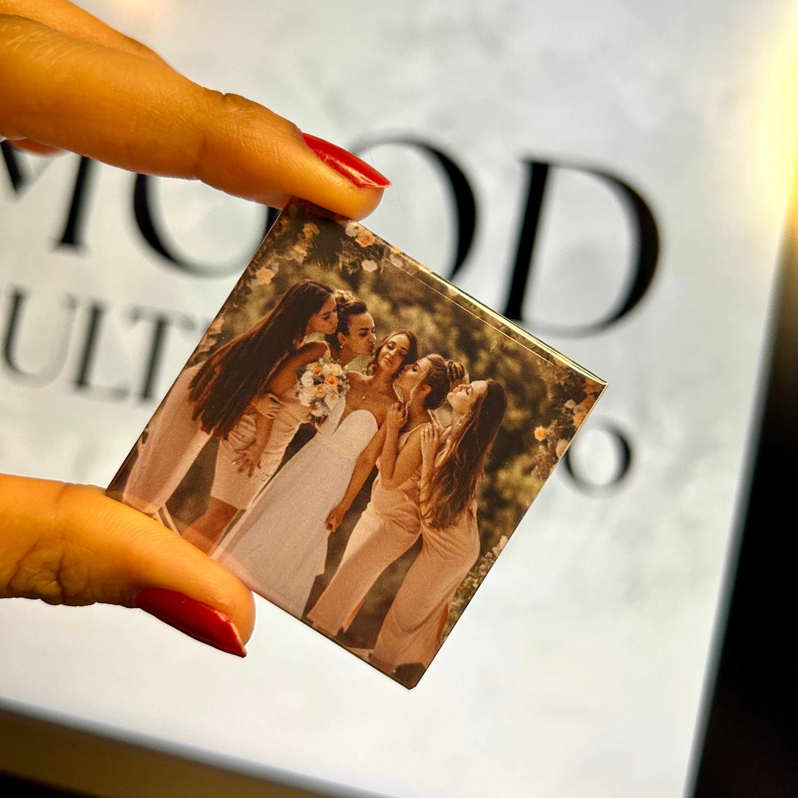 Close-up of the glossy metallic finish on a high-quality custom photo magnet.