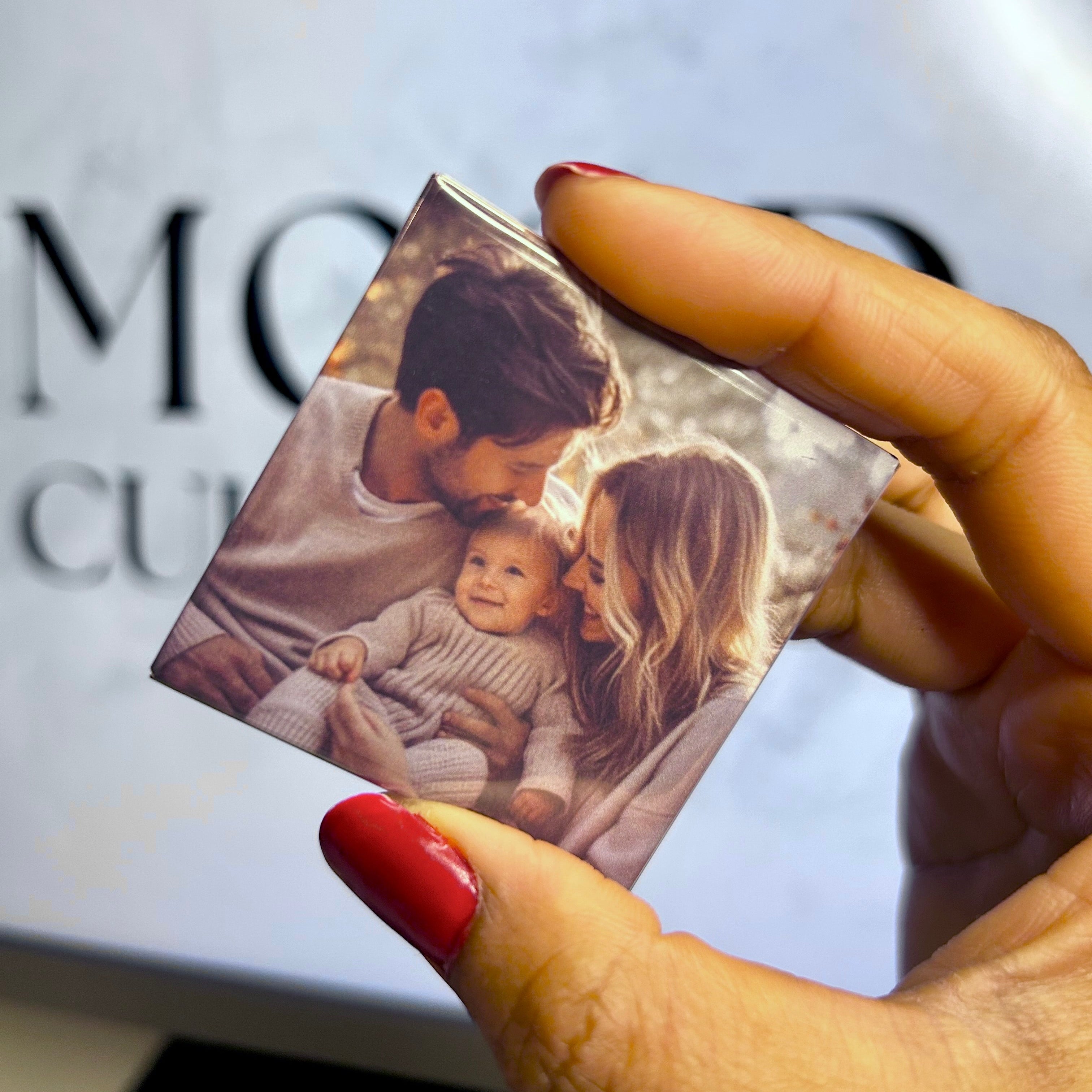 Close-up of the glossy metallic finish on a high-quality custom photo magnet.