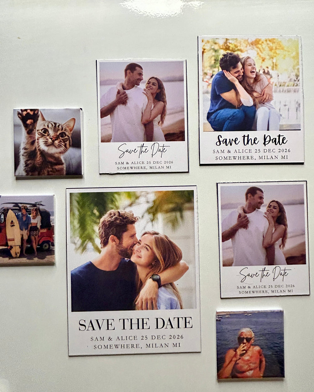 Personalized save the date photo magnets displayed on a modern refrigerator in a bright kitchen setting.