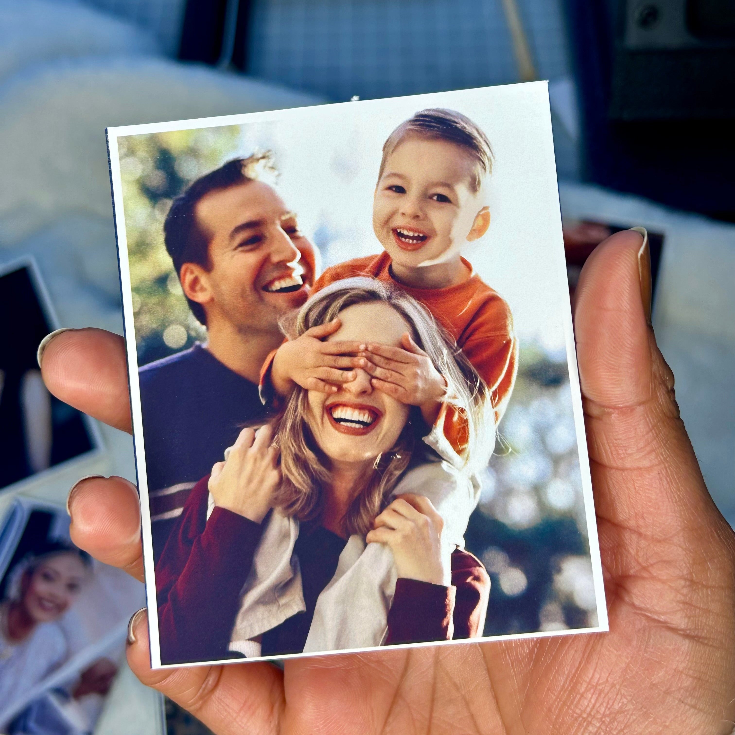 Custom photo magnet with family picture printed on premium glossy photo paper.