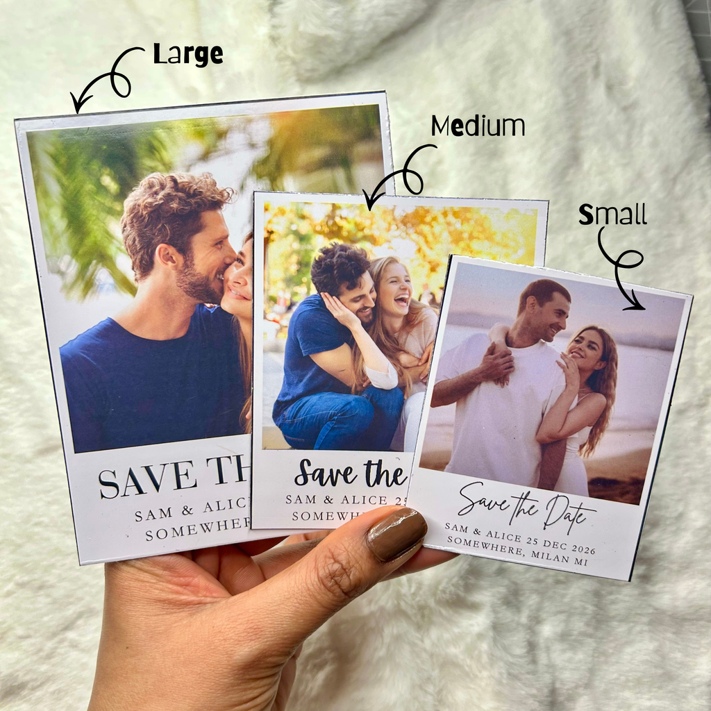 Save the date magnets held in hand to show size and scale